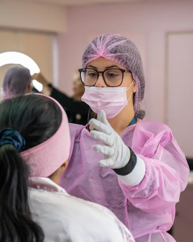 Adriana supervising a student during practical work