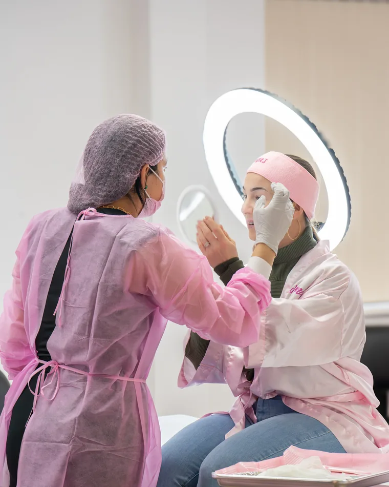A student working on a model's brows