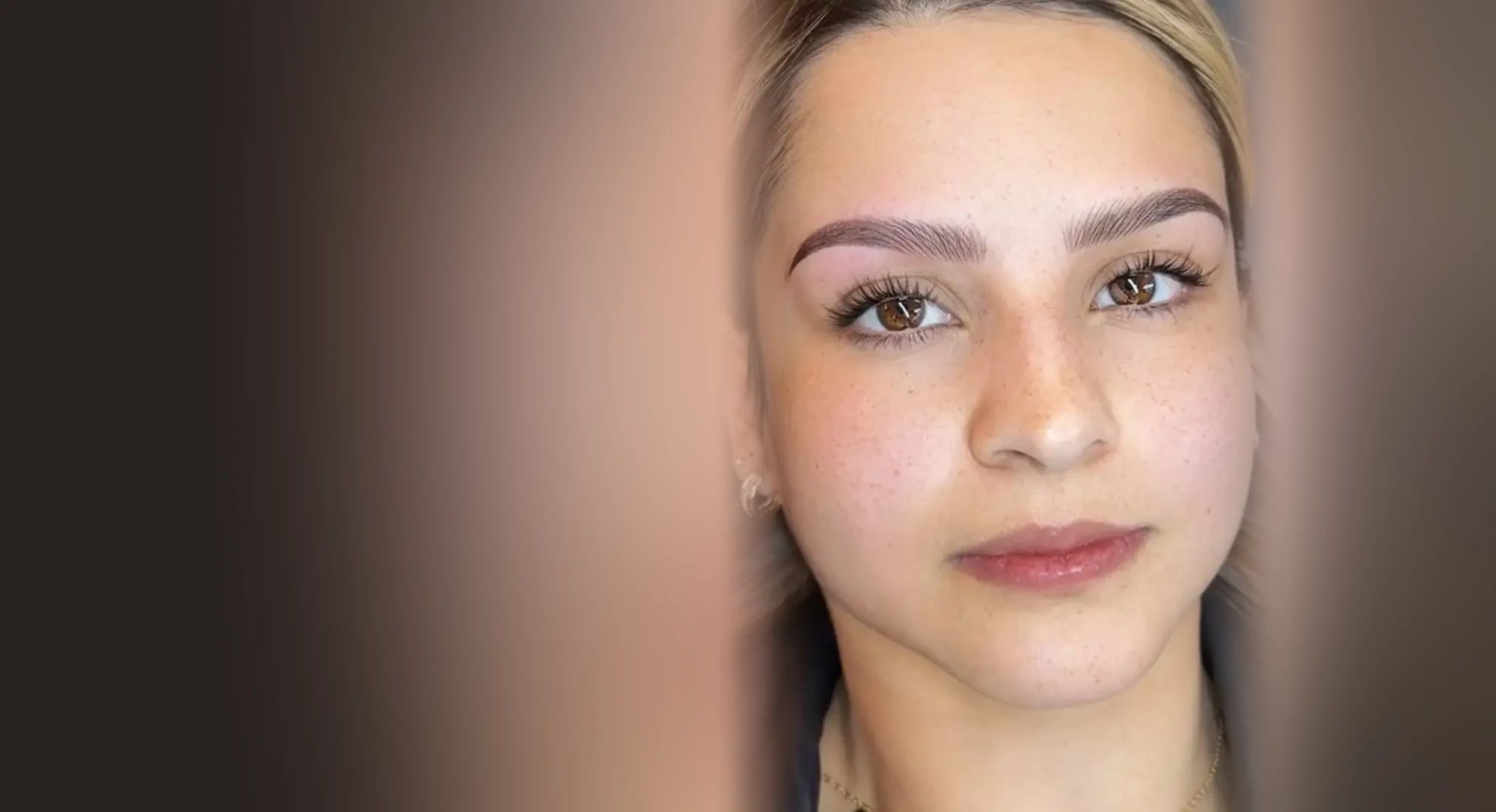 Healed Nano Combo Brows on a client, with hair-like strokes softened by powder shading