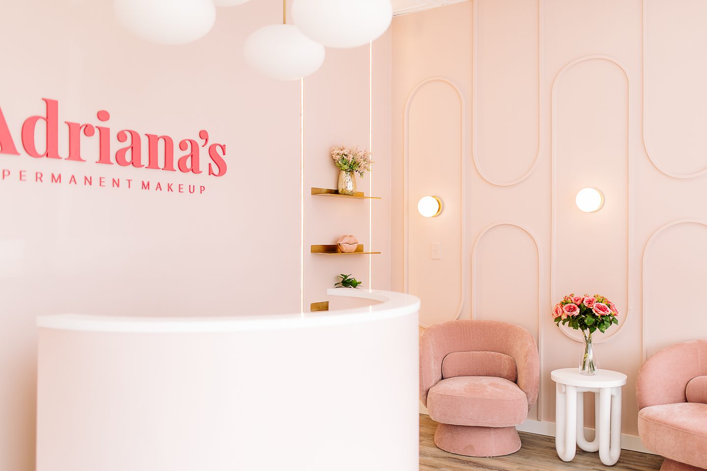 Reception of the Salem, NH permanent makeup studio with the Adriana's Permanent Makeup wall logo
