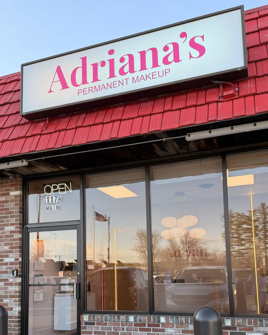 Storefront of Adriana's Permanent Makeup on Main Street in Salem, NH, at sunset
