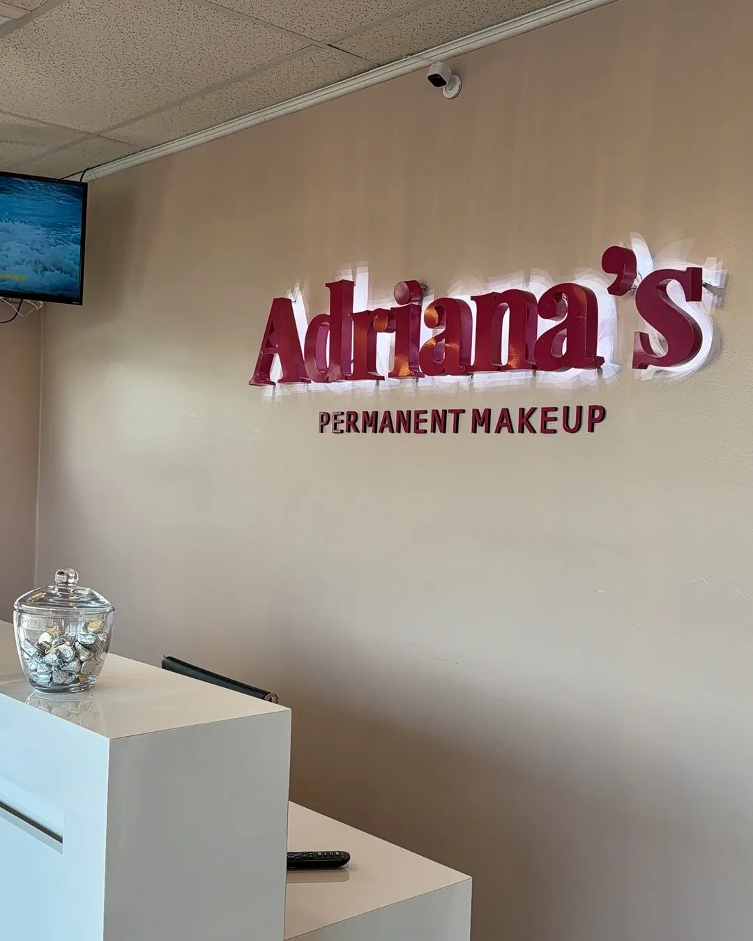 Adriana's Permanent Makeup branded sign at the reception of the Wilmington, MA studio