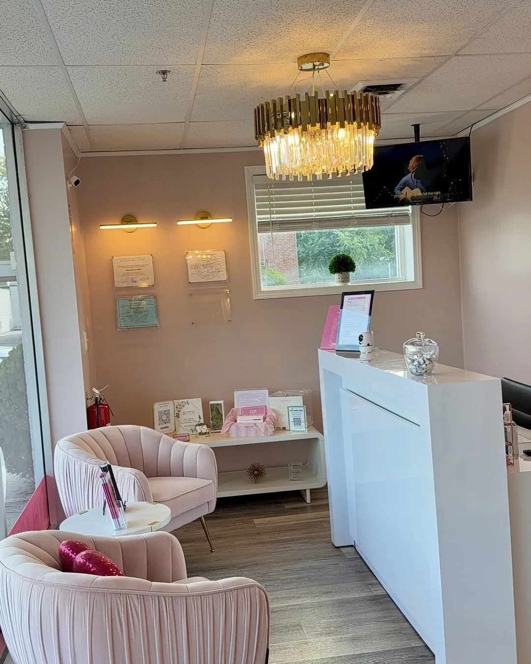 Reception desk and consultation area inside the Wilmington, MA permanent makeup studio